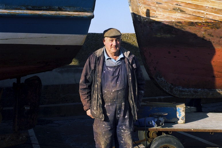 Archibald Dawson in front of one of the boats he built